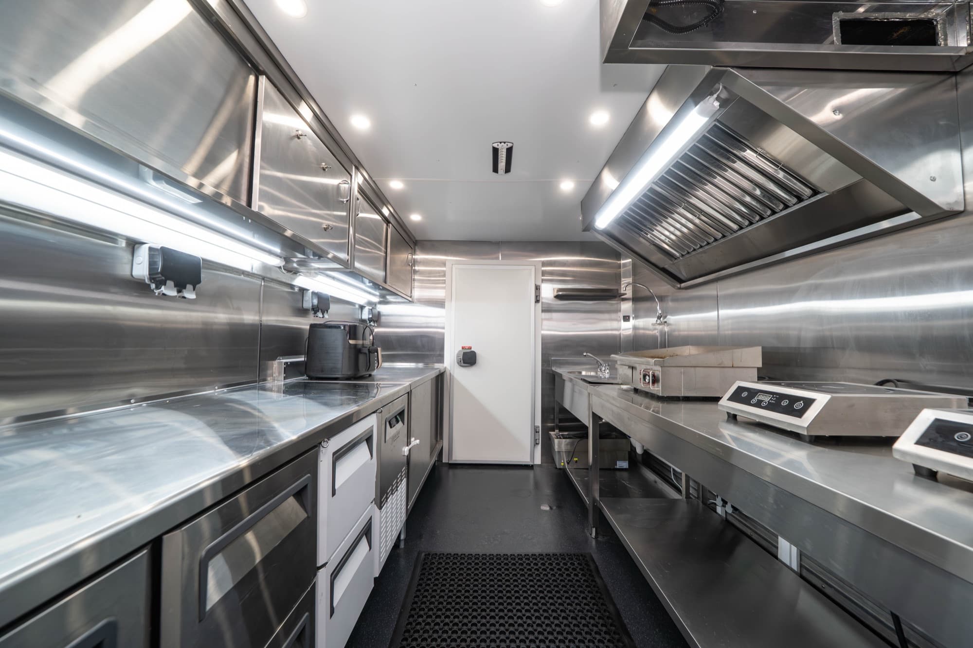 Stainless-steel interior of Medley's mobile prep kitchen, fully equipped for production catering
